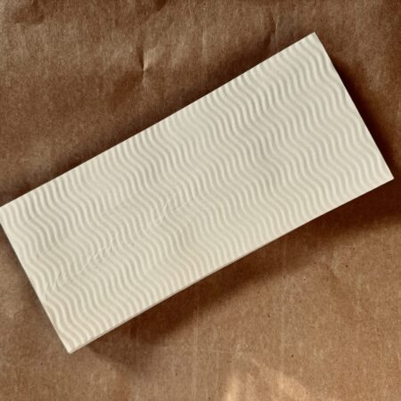 White flat lay 9.38 inches by 4.13 inches sand dunes textured envelope by UX BOXES