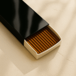 3-quarter view of a DIY Black Glossy Incense Packaging by UX BOXES® on a off-white sandstone countertop