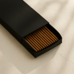3-quarter view of a DIY Black Incense Packaging by UX BOXES® on a off-white sandstone countertop