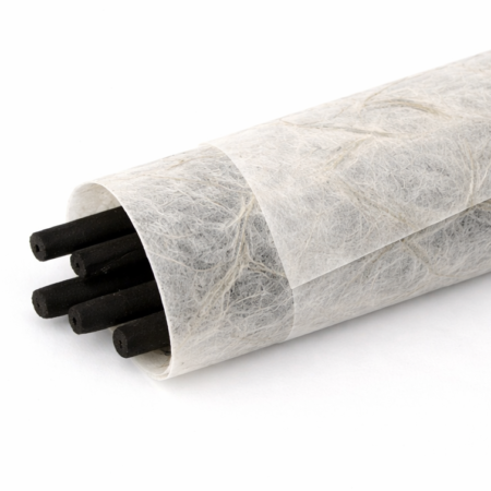 Bundle of black incense sticks wrapped in translucent mulberry paper, with visible natural fibers and a soft, organic texture against a clean white background.